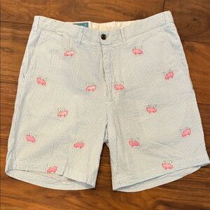 Men’s Castaway Blue and White Seersucker Shorts w/ pink embroidered flying pigs.